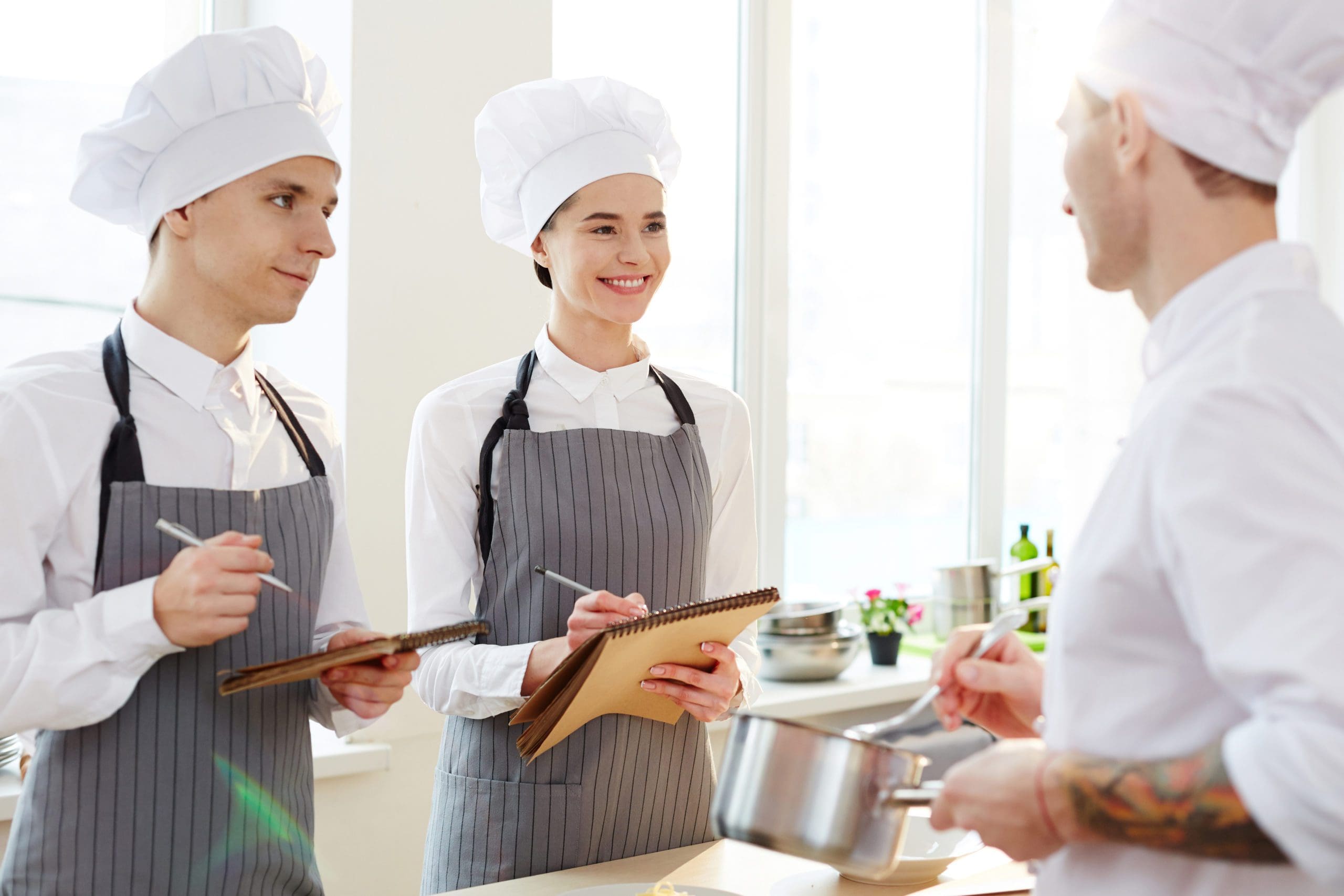 Making notes at pasta-making cooking class