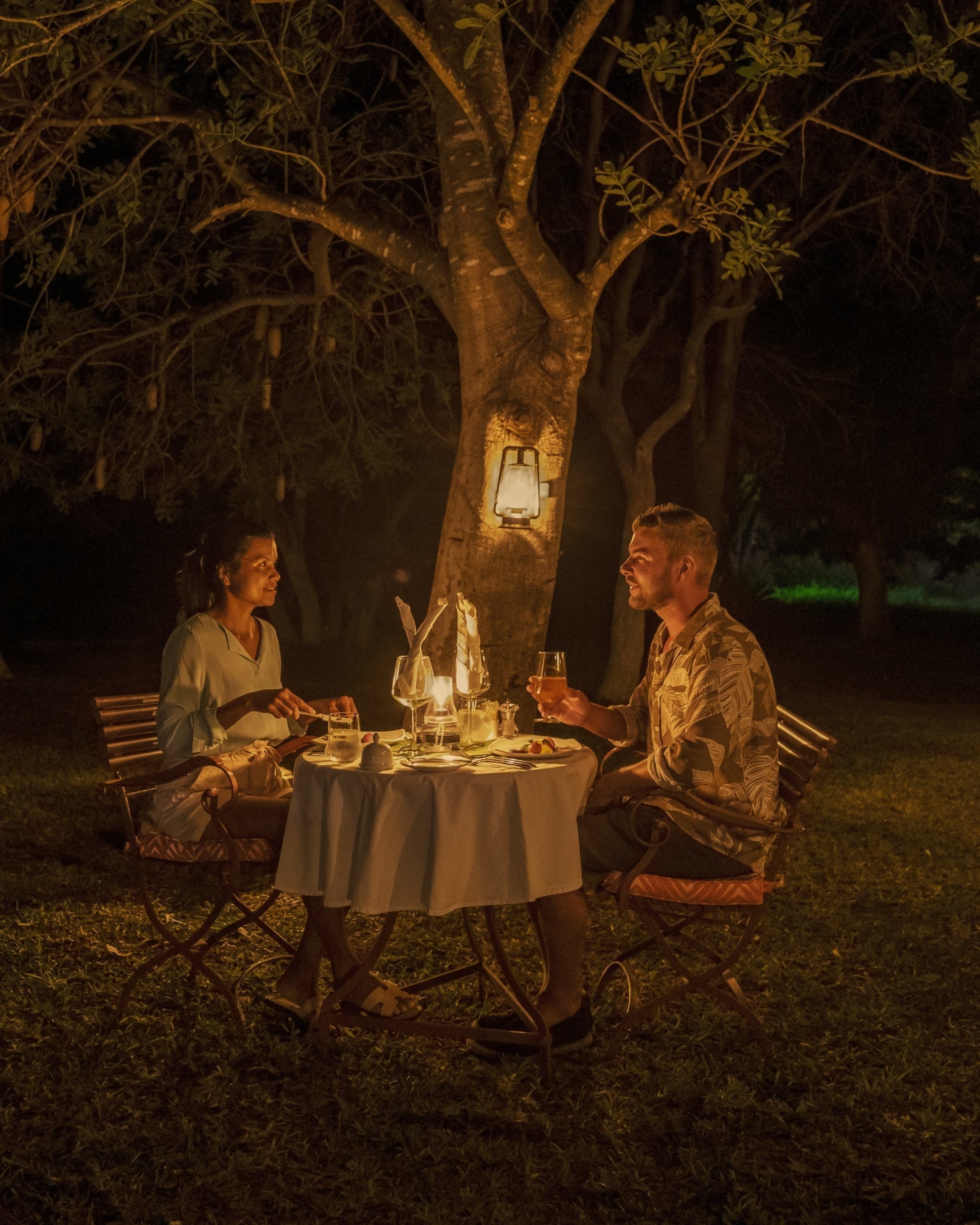 Couple,Men,And,Woman,Romantic,Dinner,On,A,Luxury,Safari,